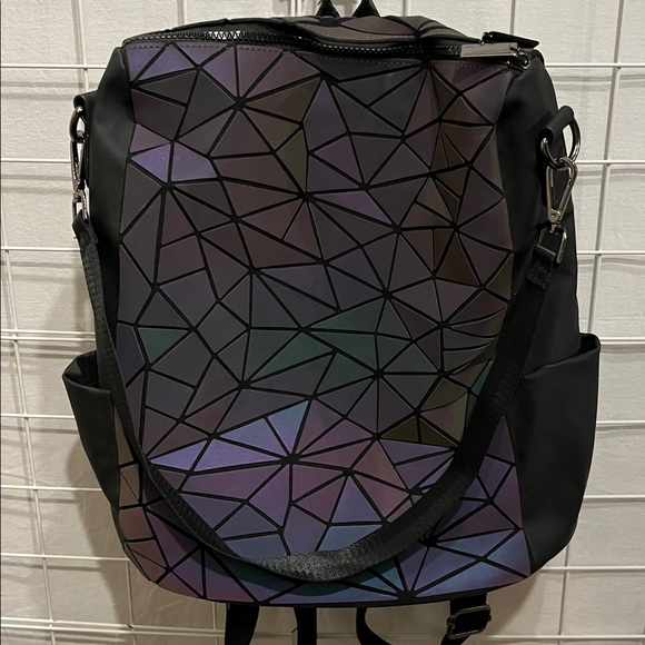 Luminous Geometric Pattern Backpack 
NWOT Roomy with black zipper. Side pockets